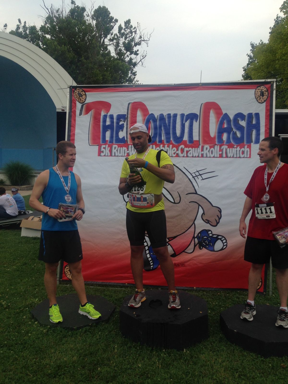 Yasir Salem on the podium at the Donut Dash 5K
