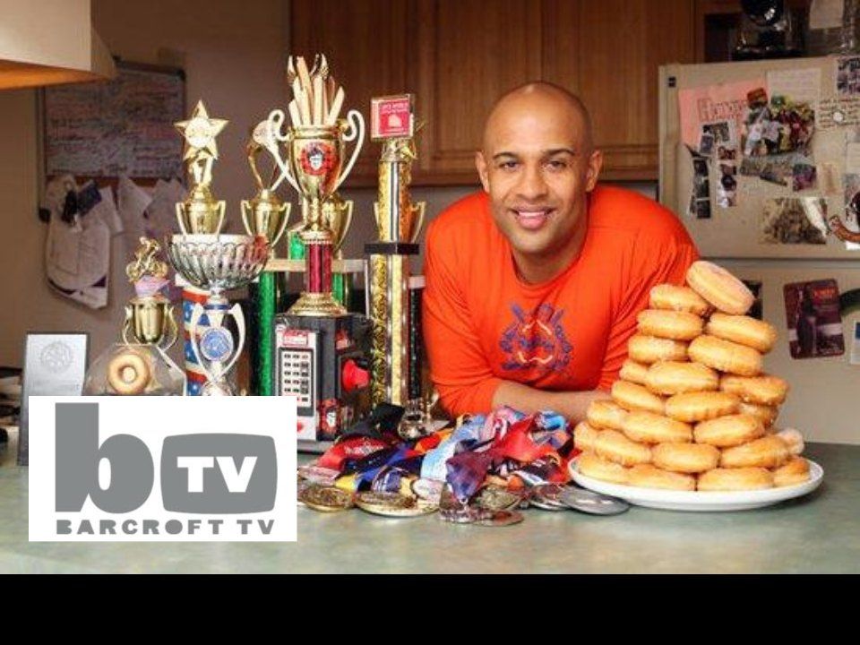 Barcroft TV still: Yasir Salem with trophies and a pile of donuts