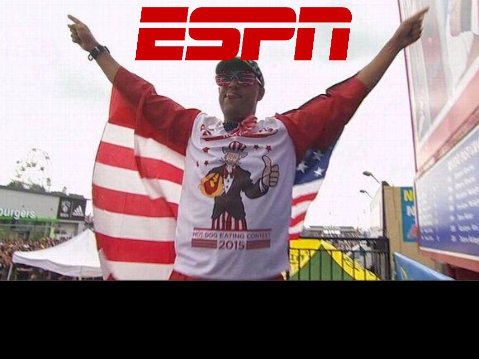 ESPN still: Yasir Salem with arms raised in an American flag cape