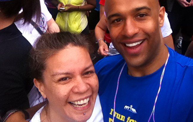 Gweneviere Mann and Yasir Salem smiling together at a race