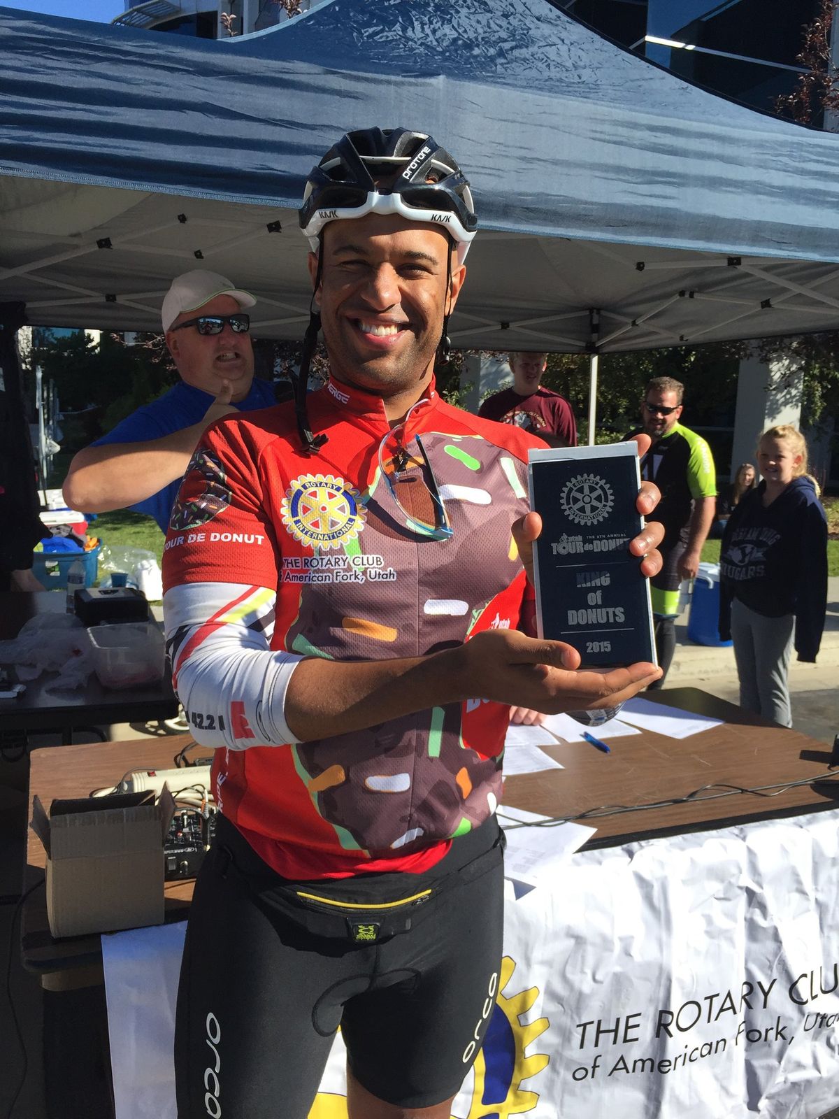 Yasir Salem holding the Utah Tour de Donut King of Donuts 2015 plaque